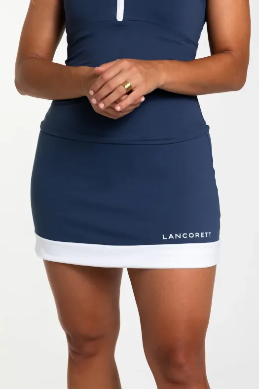 Falda de pádel para mujer de color azul oscuro con una franja inferior de color blanco